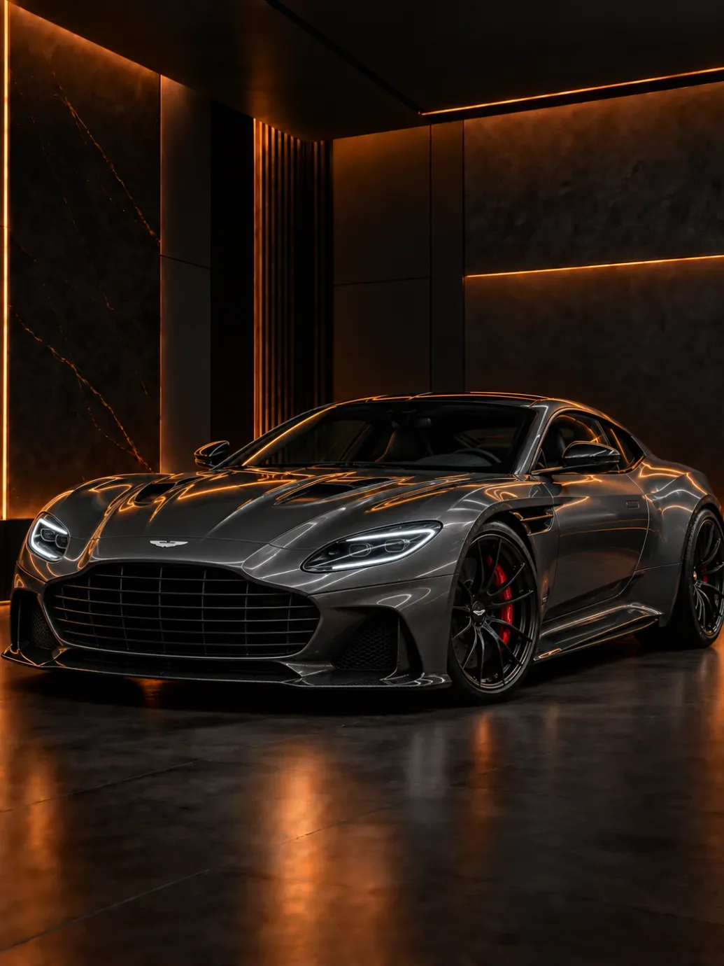 Grey Aston Martin coupe with a large mesh grille and red brake calipers